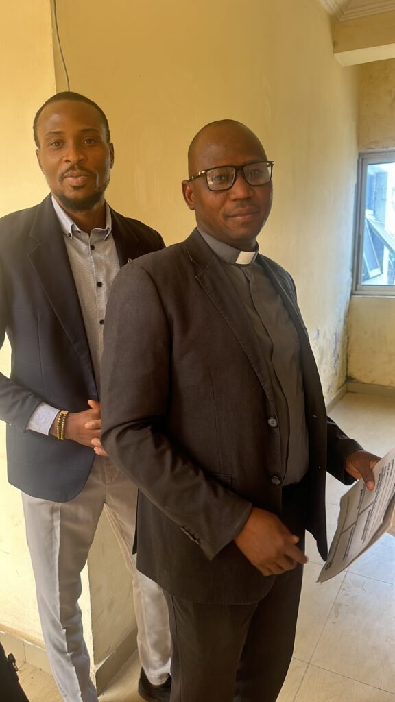 Fr. Dr. Richard Gokum (R) and Mr. Haruna Ibrahim Isaac; Executives at the VUEF PDO lunching