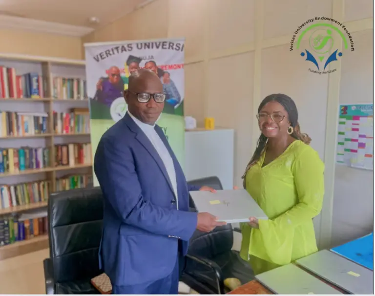 CEO Presenting laptops to beneficiaries